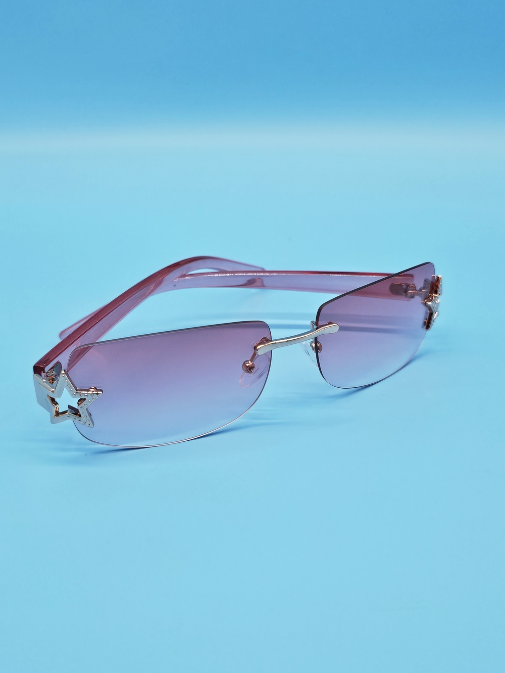 Stylish Rimless Pink Gradient Sunglasses with Star Accent